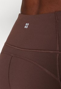 Sweaty Betty SUPER SOFT FLARE YOGA TROUSERS - Donji dijelovi trenirke - cacao brown
