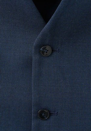Navy blue textured blazer fabric with a subtle check pattern. Features a black button at the closure and a visible stitch detailing.