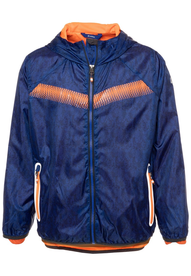 Tummansininen takki, jossa on oranssi huppu ja yksityiskohdat. Takissa on teksturoitu oranssi raita ja vetoketjulliset taskut. Valmistettu kevyestä materiaalista.