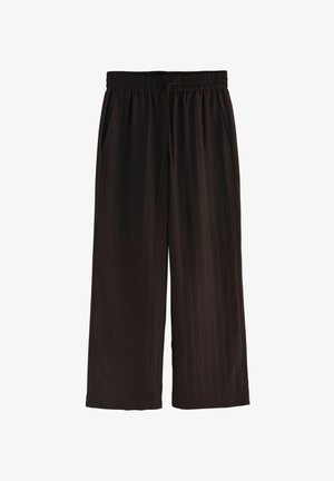 Pantaloni neri larghi con vita elastica, coulisse, tasche laterali e gambe ampie, mostrati su sfondo bianco.