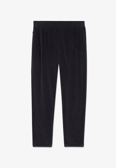 Pantalon en velours côtelé noir avec une ceinture élastique et des poches latérales, présenté à plat sur un fond blanc.