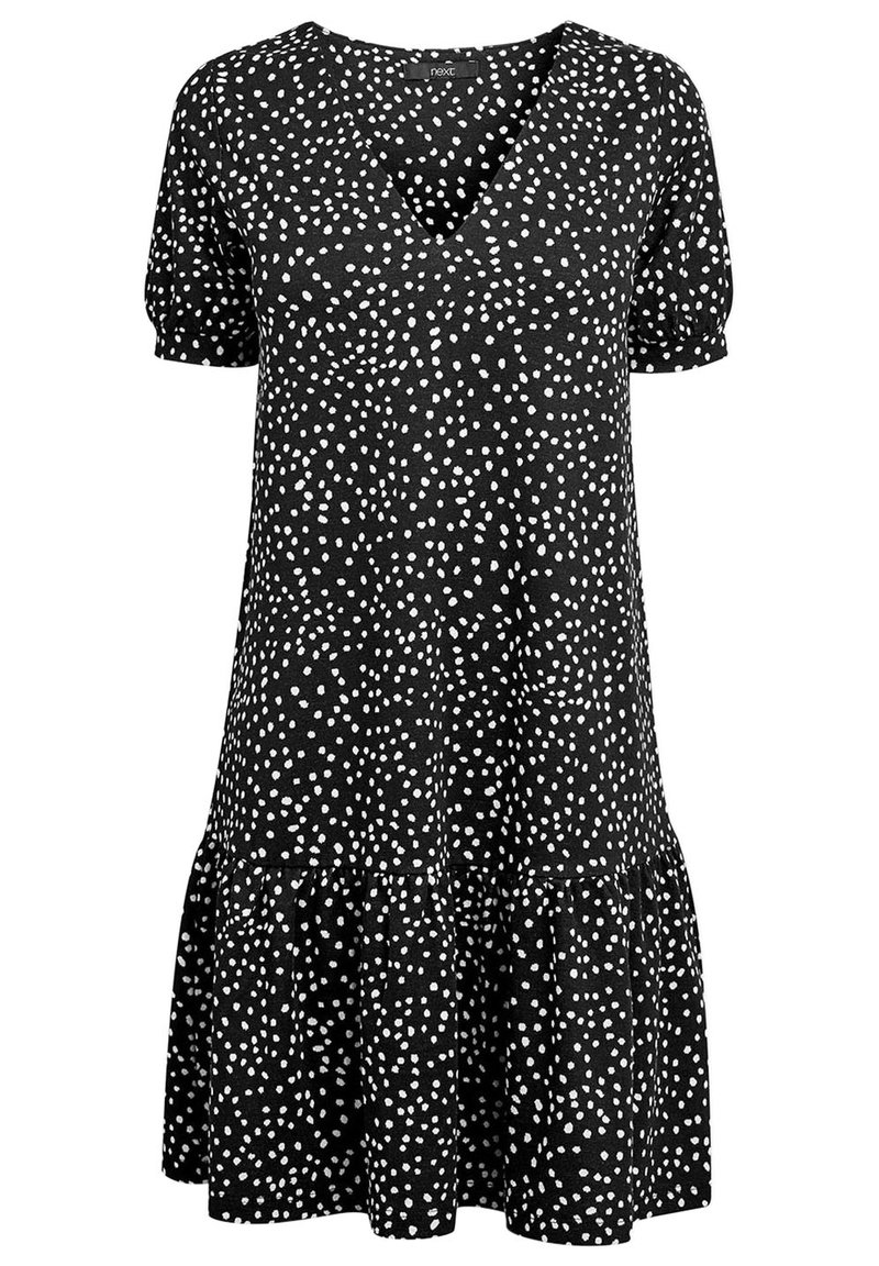 Robe noire avec un décolleté en V, des manches courtes bouffantes et un ourlet froncé. Décorée de pois blancs sur un tissu texturé.