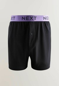 Fekete boxer alsónadrág lila derékkal, melyen fekete betűkkel a "NEXT" felirat olvasható. Elején gombos záródás, puha és sima tapintással.