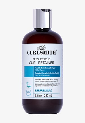 Bouteille en verre marron de CURLSMITH Frizz Rescue Curl Retainer avec un capuchon argenté. L'étiquette présente des accents bleus et liste les ingrédients en anglais et en français.