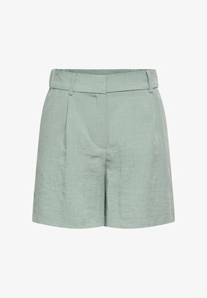Short en lin vert clair à taille haute avec passants de ceinture, pli sur le devant et fermeture dissimulée sur le devant.