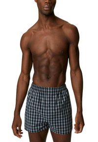Marineblau- und weiße karierte Boxershorts mit elastischem Bund, einem einzigen Knopfverschluss und lockerem Schnitt.