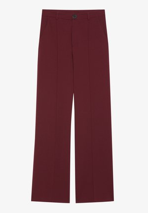 Burgundy trousers with a wide leg design, featuring a button closure, two side pockets, and creased front detailing. Smooth fabric texture.