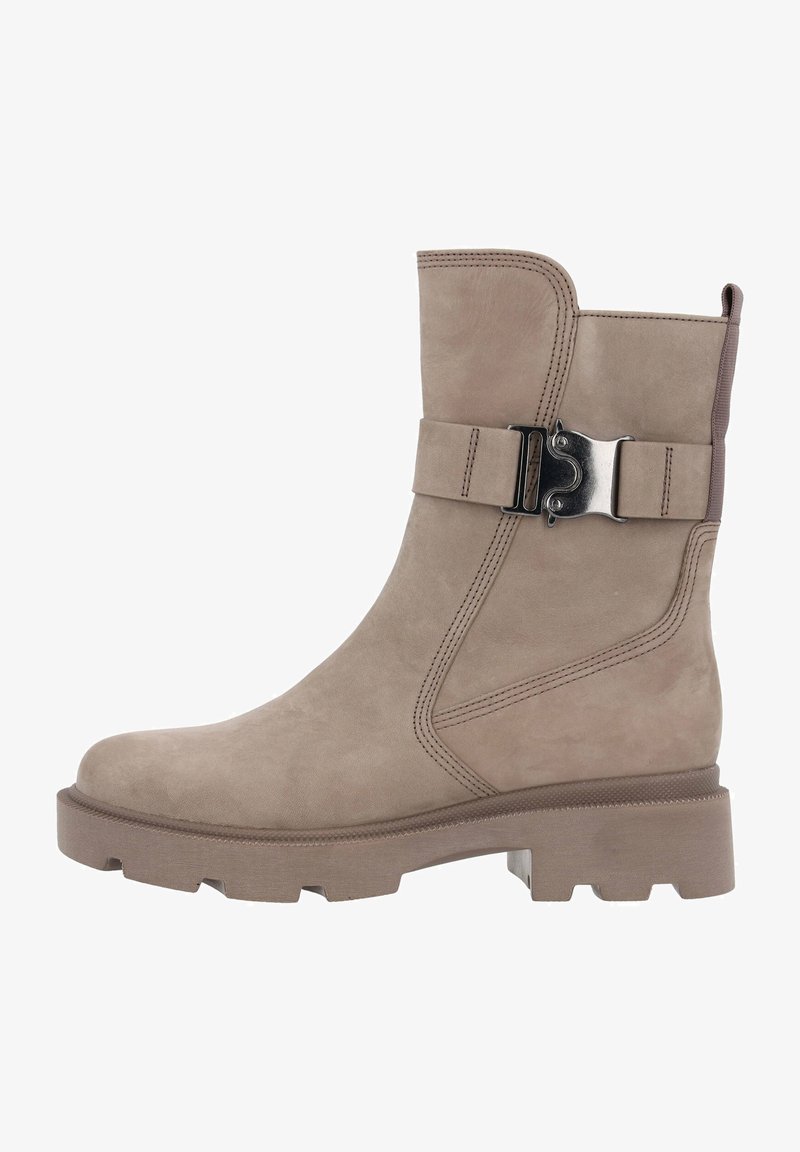 Taupe suede ankle boot with a rounded toe, chunky rubber sole, and a decorative buckle strap on the side. Stitching details visible.