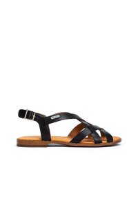 Zwarte leren sandalen met gekruiste banden, verstelbare enkelgesp en een tan kurkachtige voetbed. Platte zool met een minimaal profiel.