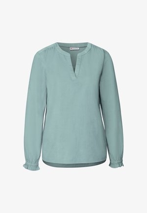 Blusa verde menta a maniche lunghe con scollatura a V, spalle arricciate e polsini elastici. Tessuto liscio e leggero. Senza motivi visibili.