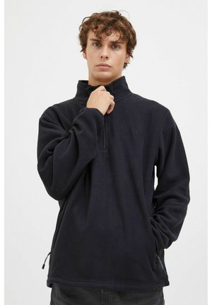 Pull en polaire noir avec un col haut, fermeture éclair mi-longue à l'avant et poches latérales. Texture douce et coupe décontractée. Logo subtil sur la poitrine.