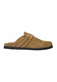 Brown suede slip-on shoe with a black rubber sole, featuring a crisscross strap design and decorative white stitching along the seams.
