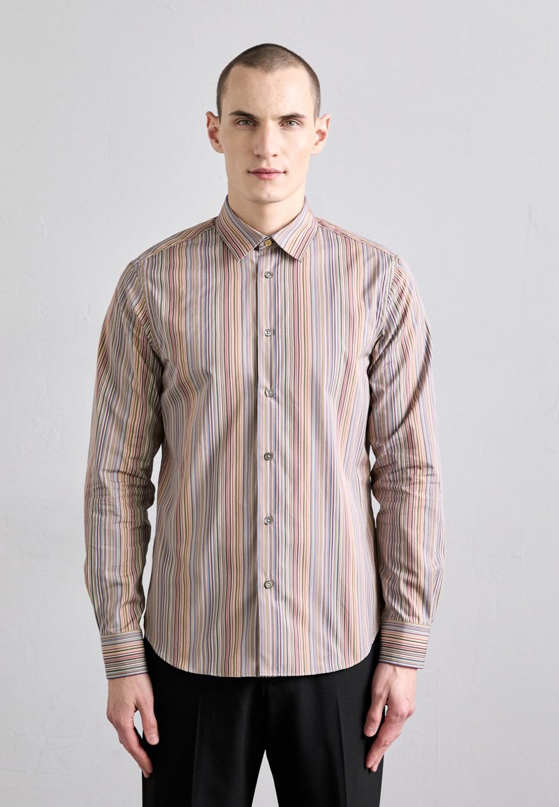 Striped button-up shirt featuring vertical lines in various colors, collar, and button closures with a smooth fabric texture.