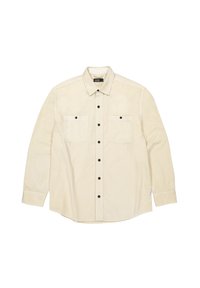 Beige overhemd met knopen van zachte stof, met lange mouwen, twee borstzakken met zwarte knopen en een gebogen zoom.