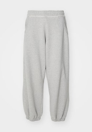 Light grey sweatpants with elastic waistband and cuffs, featuring side pockets and a soft, textured fabric. Simple design without patterns.