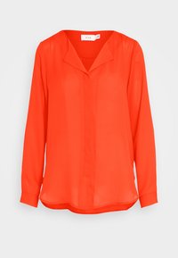 Blusa rossa a maniche lunghe in tessuto trasparente con scollo a V e dettagli di cucitura discreti. Presenta una vestibilità ampia e un orlo curvo.