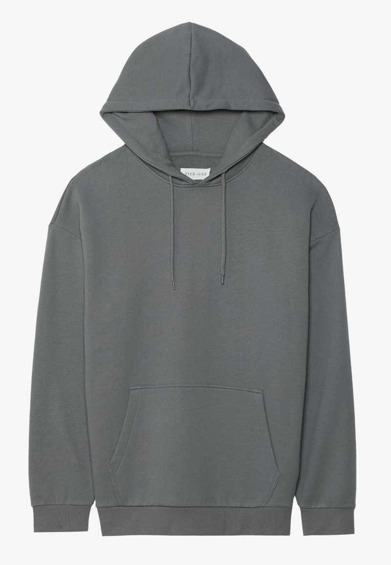 Pilkas megztinis su kapuci, pagamintas iš minkštos medžiagos. Yra priekinė kišenė, raištelio reguliuojama kapučio sistema ir raukiniai rankogaliai, su laisvos formos dizainu.