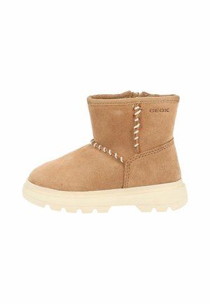 Light brown suede ankle boot with thick beige sole and decorative white stitching, featuring a side zipper and the Geox logo.