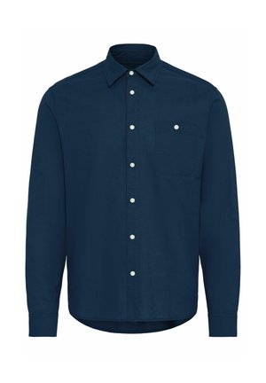 Mornarsko modra dolga majica iz bombaža, z gumbom spredaj, s koničastim ovratnikom in enim žepom na prsih z belim gumbom.