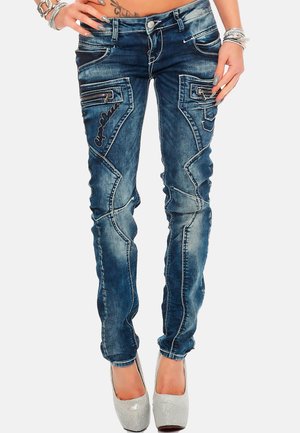 Slim-Fit-Jeans aus dunkelblauem Denim. Mit vorderen und hinteren Taschen, dekorativen Nähten und Reißverschlussdetails an den Taschen. Sanfte Textur.