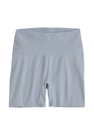 Shorts de cycliste sans coutures, taille haute, à taille côtelée bleu clair, étalés à plat sur un fond blanc.