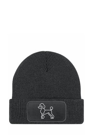 Knitted black beanie with a cuff, featuring a white outline of a poodle on a black label. Textured fabric and close-fitting shape.