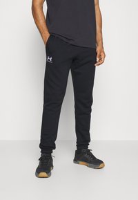 Under Armour - ICON FLEECE - Tracksuit bottoms - black/white Thumbnail Image 1