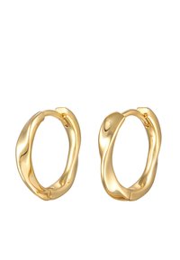 Pendientes de aro en tono dorado con un diseño ondulado. Acabado suave y brillante, forma ligeramente irregular, que cuenta con un cierre seguro.