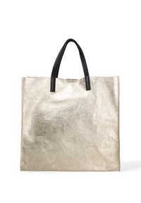 Sac fourre-tout en métal doré avec poignées noires, de forme rectangulaire, texture lisse, featuring des accents de couture blanche sur les attaches des poignées.