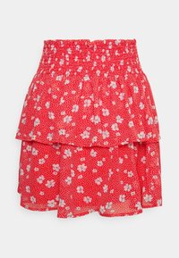 Red floral patterned skirt with a layered design, featuring a smocked waistband and lightweight, sheer fabric. White and pink flowers on a dotted background.