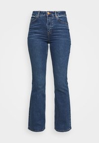 Hoge taille blauwe jeans gemaakt van denim. Flared leg ontwerp met een knoopsluiting en zakken. Beschikt over een klassieke wassing en stiksel details.