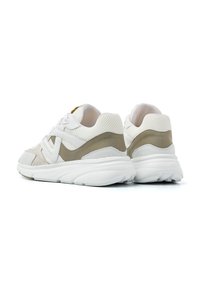 White sneakers with light gray and beige accents. Mesh and suede materials, padded collar, and textured sole. Lace-up design.