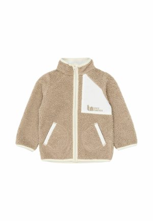 Bézs polárdzseki magas gallérral, fehér cipzárral, fehér mellzsebbel és két oldalzsebbel. Puha textúrájú, kontrasztos részletekkel.