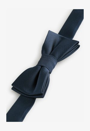 Marineblauwe vlinderdas gemaakt van gestructureerde stof met een geribbeld patroon. Heeft een opvallende strik en een glad verstelbaar bandje om vast te maken.