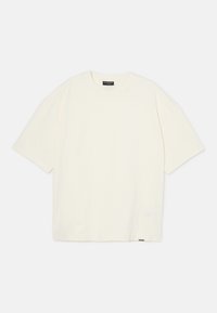 Kortearmige t-shirt in lichtcrème kleur, gemaakt van zachte katoen. Heeft een ronde halslijn en een losse pasvorm, met een klein logo label aan de zoom.