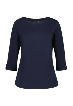 Chemise à manches longues bleu marine en coton doux, avec un col en scoop et des manches roulées agrémentées de boutons. Design classique et ajusté.