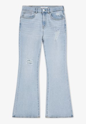 Lys blå utsvingte jeans laget av denim med slitte detaljer, inkludert revne partier på lårene og en ren kant.
