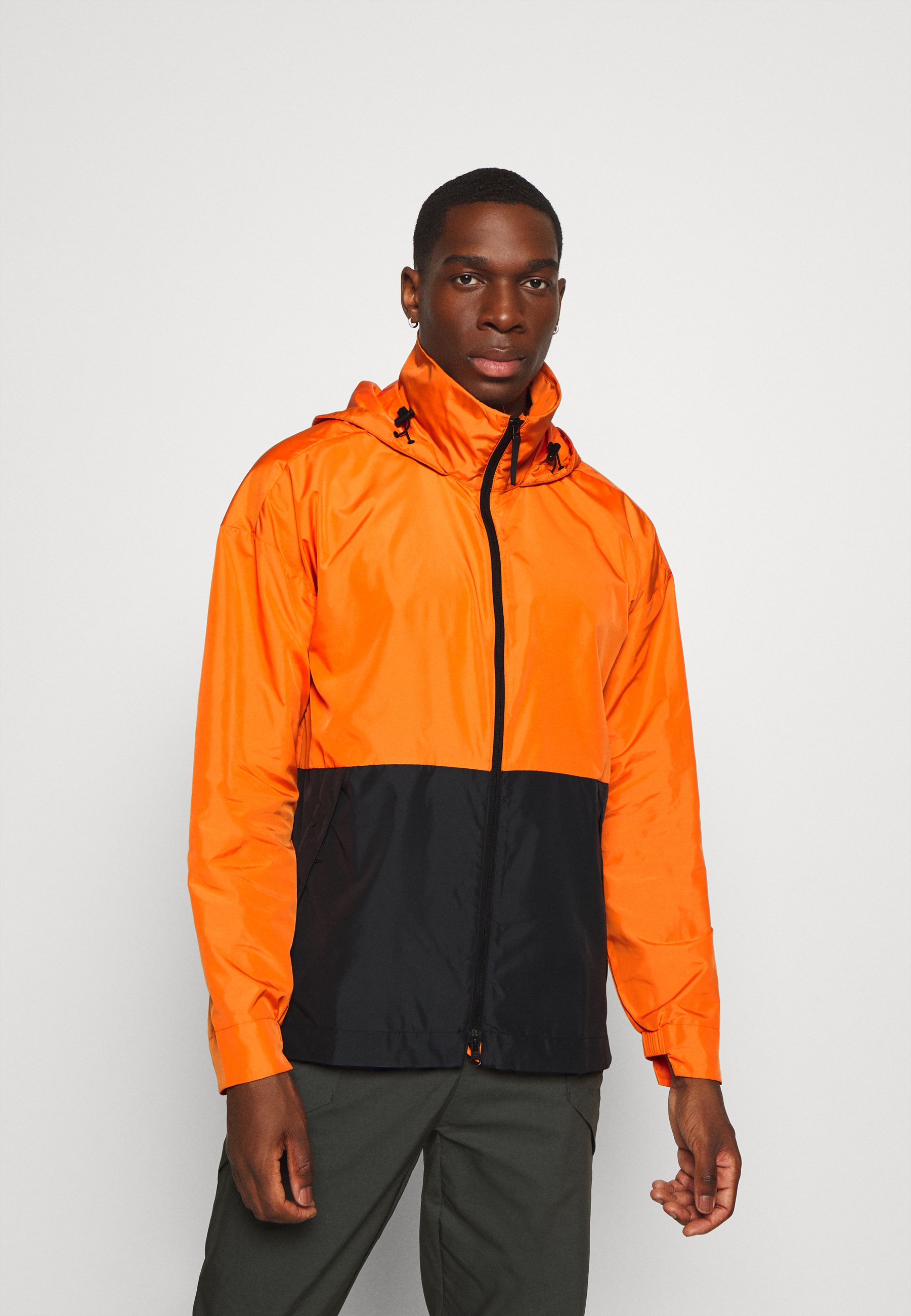 adi windbreaker black orange white