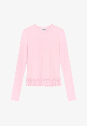 Chemise rose clair à manches longues avec encolure ronde et détail à volants au bas.
