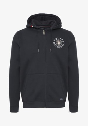 Tmavě modrá zipová mikina vyrobená z měkké látky; má logo na prsou, kapuci se stahovací šňůrkou a dvě přední kapsy.