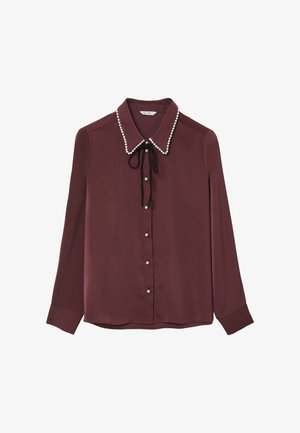 Burgundy long-sleeve blouse with pearl-trimmed collar, black ribbon bow, and pearl buttons down the front.
