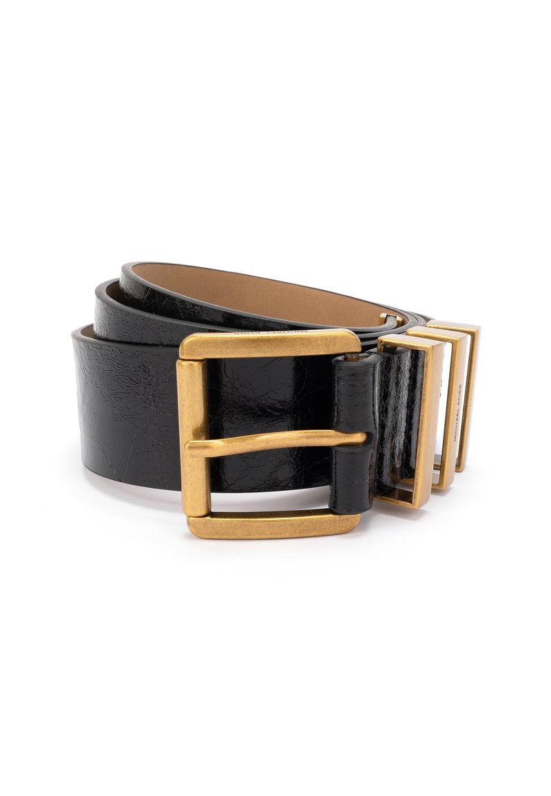 Juodas odinis diržas su tekstūruota paviršiumi. Yra didelis, blizgus auksinis sagtis ir reguliuojama kniedė. Lygus vidinis pamušalas užtikrina komfortą.