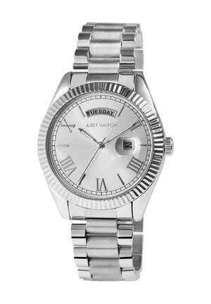 Silver stainless steel watch with a ridged bezel, Roman numeral markers, and a date display showing Tuesday. Metal link bracelet.