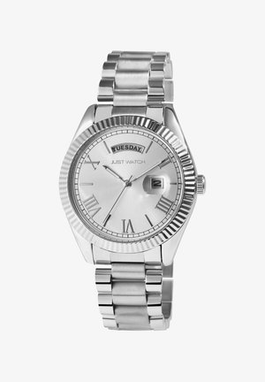 Silver stainless steel watch with a ridged bezel, Roman numeral markers, and a date display showing Tuesday. Metal link bracelet.