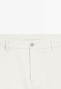Light beige cotton trousers with a standard waistband, a button closure, belt loops, and a smooth texture.