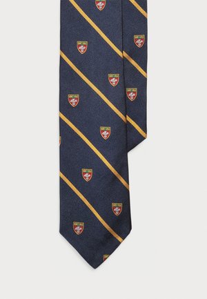 Marineblauer Krawatte mit diagonalen gelben Streifen, versehen mit kleinen gestickten roten und goldenen Logos. Strukturiertes Gewebe, spitze Enden und traditionelles Design.