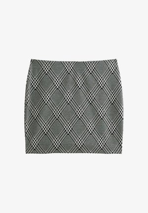 Mini-jupe à carreaux noire et blanche présentant une coupe ajustée, un tissu texturé et un motif en losanges avec des lignes et des formes qui se croisent.