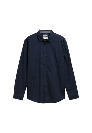 Camisa de botones de manga larga color azul marino con cuello, diseño liso y dobladillo ligeramente curvado, exhibida sobre un fondo blanco.