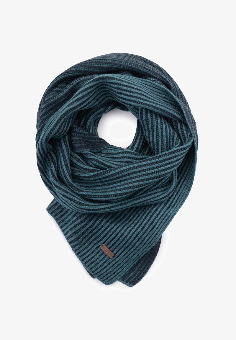 Écharpe bleu canard et bleu foncé rayée, fabriquée en tissu doux. Présente une texture tissée et une petite étiquette de marque sur un côté.