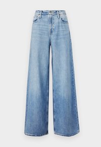 Jasnoniebieskie jeansy o szerokich nogawkach z surowym wykończeniem, z klasycznym pięciopocketowym designem i zapięciem na guziki. Wykonane z denimu.